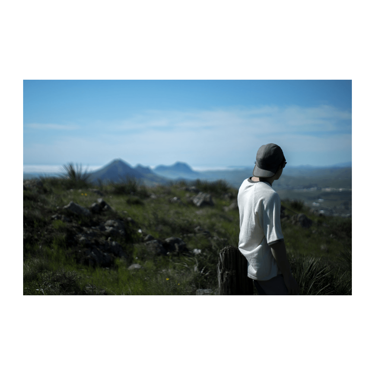 Bract apparel young man looking out at mountains in sustainable clothes