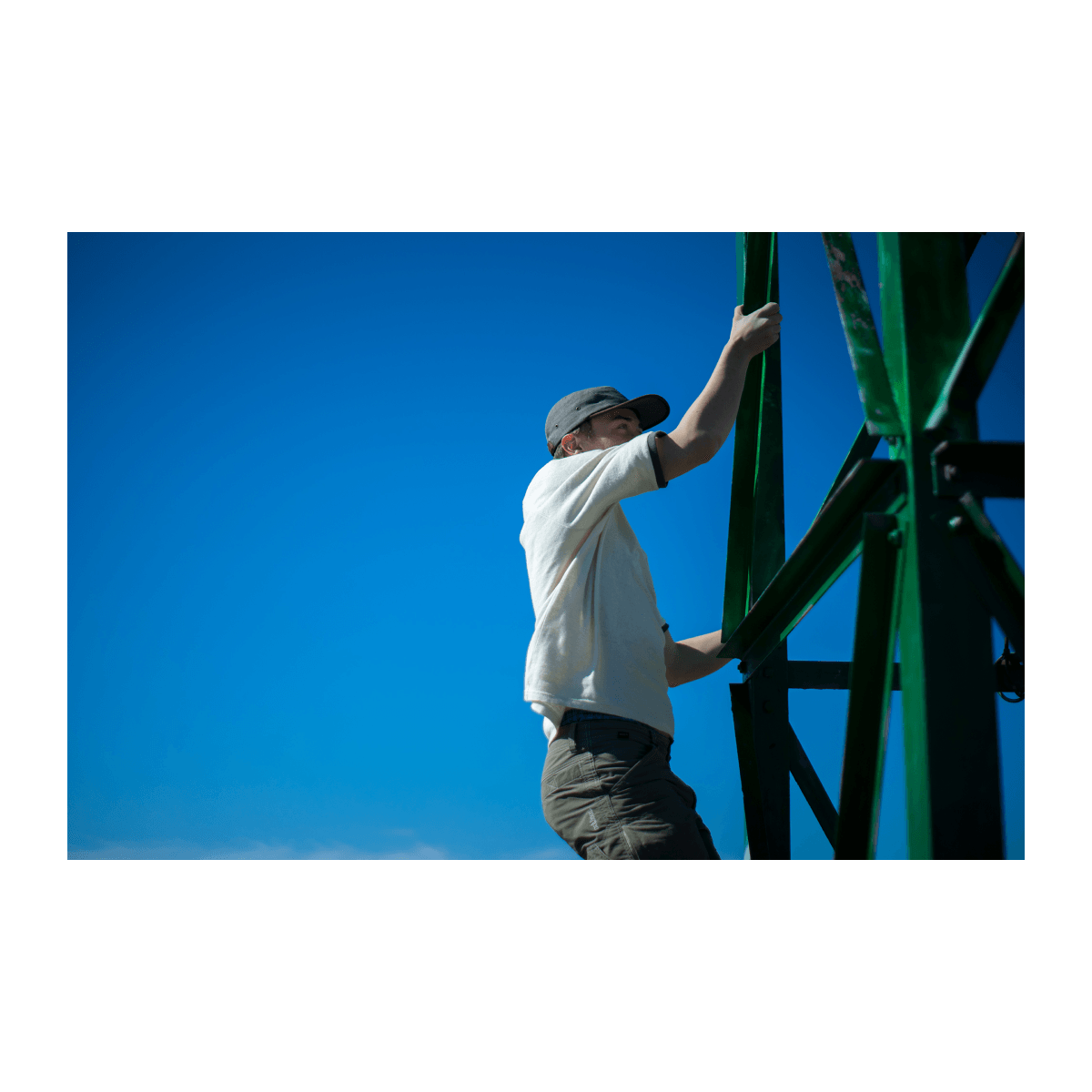 Bract apparel young man climbing tower in hemp clothes